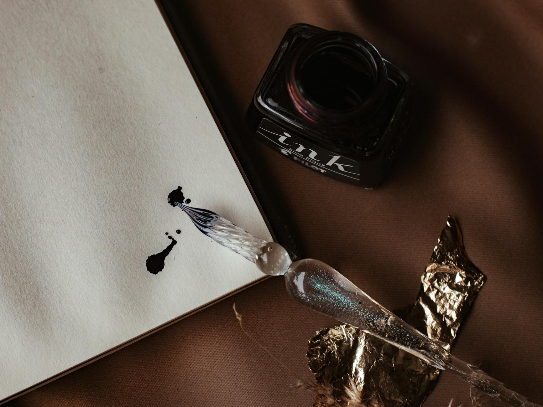 ink bottle beside a white paper