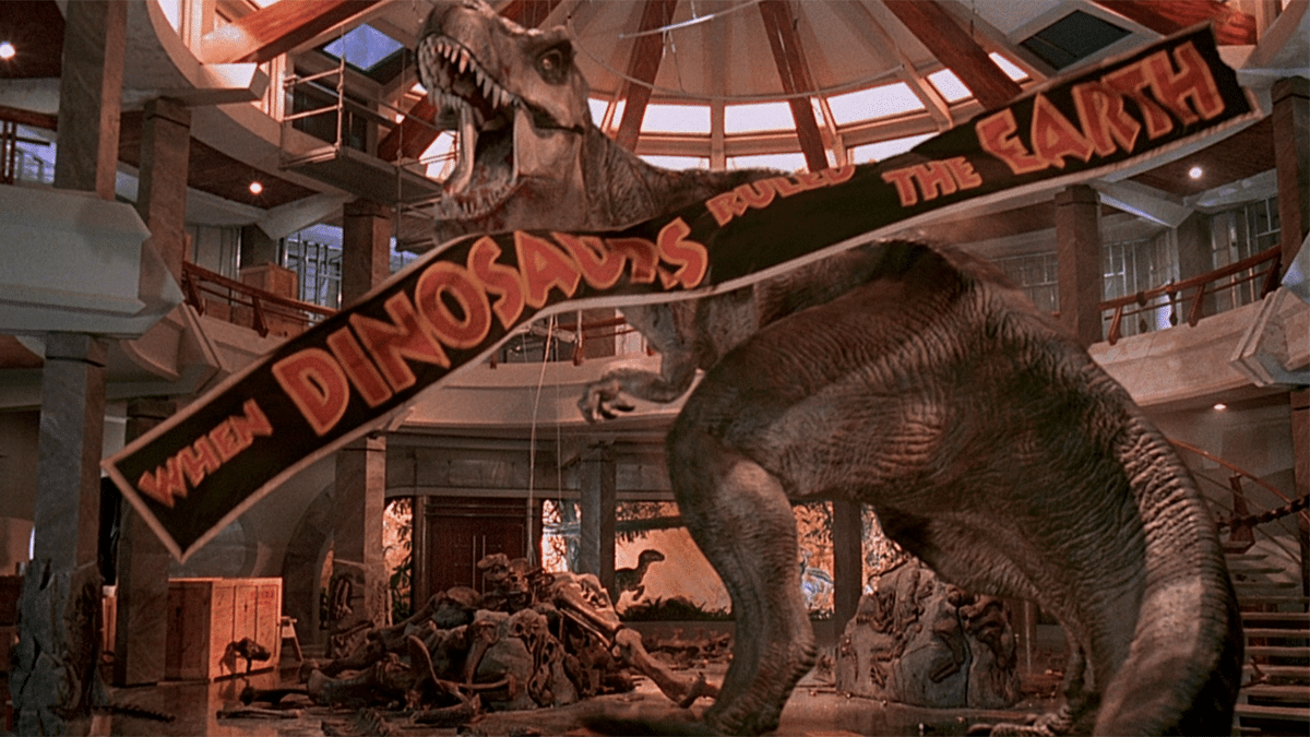 The Tyrannosaurus Rex in 'Jurassic Park' by Steven Spielberg, in the museum with the banner 'When Dinosaurs Ruled the Earth'